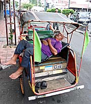'A Becak Driver, sleeping in his Becak' by Asienreisender